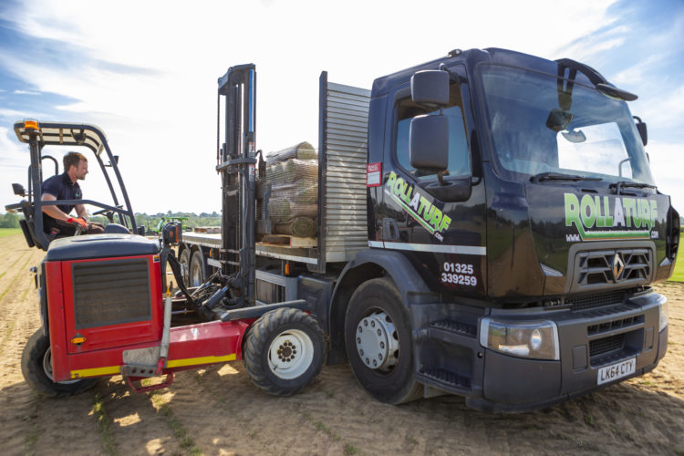 Loading grass turf on to truck