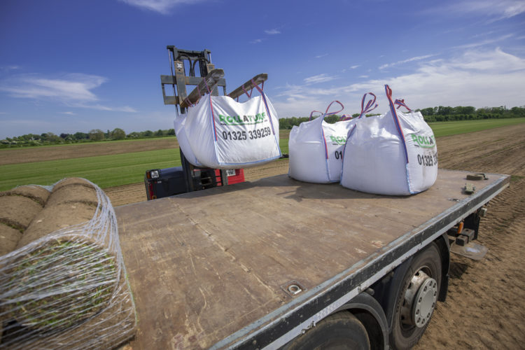 Loading premium topsoil for delivery