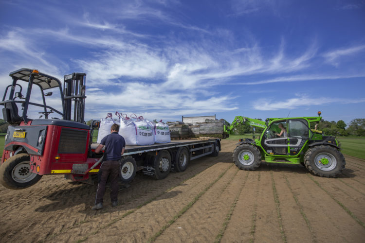 Loading garden turf for delivery