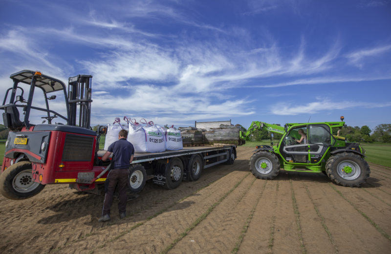 Loading garden turf for delivery
