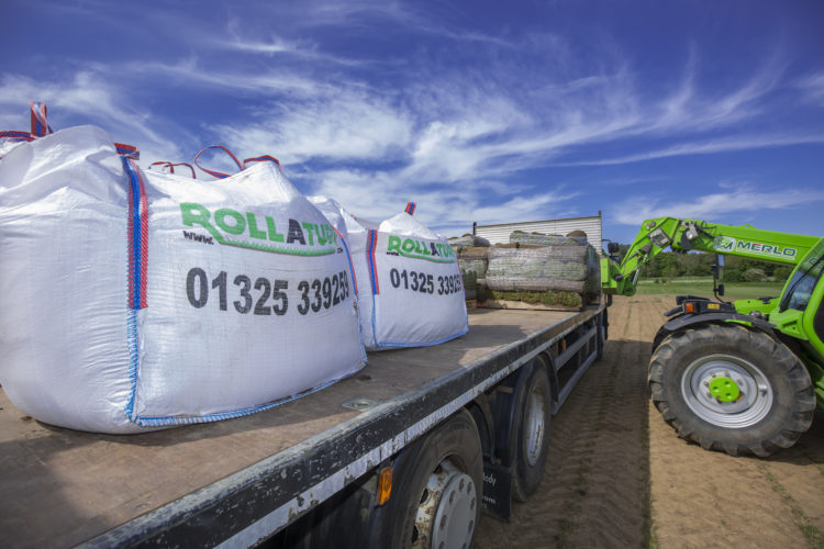 Loading garden turf for delivery