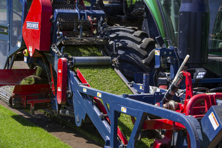 Rollaturf tractor harvesting garden turf