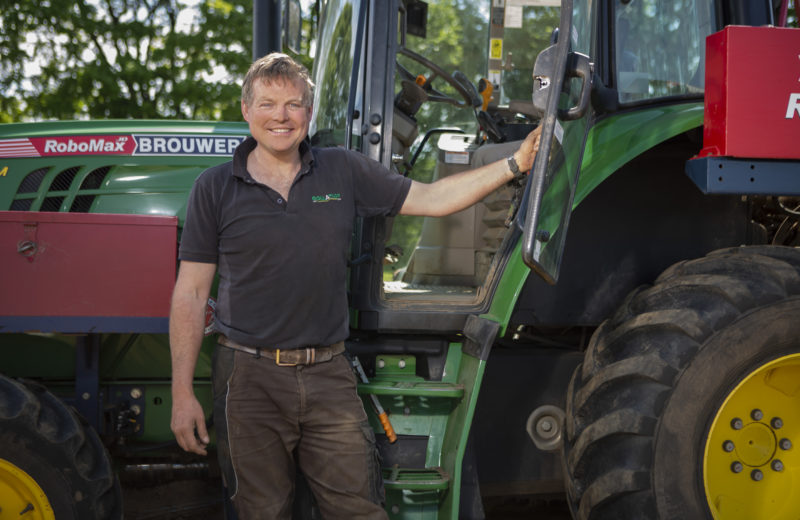 Rollaturf team member by the grass turf harvester